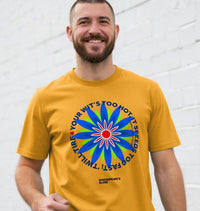 Man wearing a yellow t-shirt with a colorful graphic design on a white background