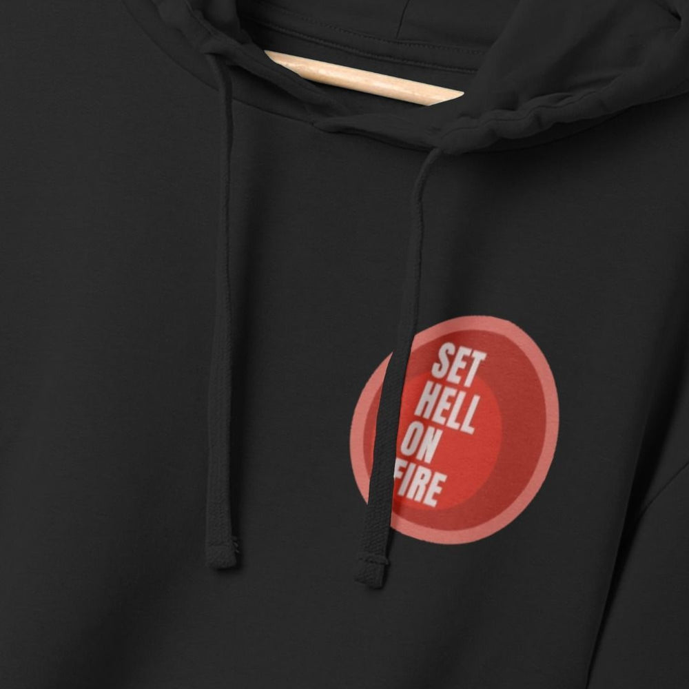 Black hoodie back with red circular graphic with white graphic text over top on upper left chest