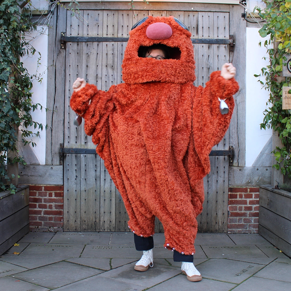 Burnt orange monster costume with oversized head