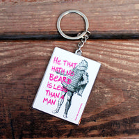 Metal keyring featuring an illustrated Elizabethan figure and the quote “He that hath no beard is less than a man