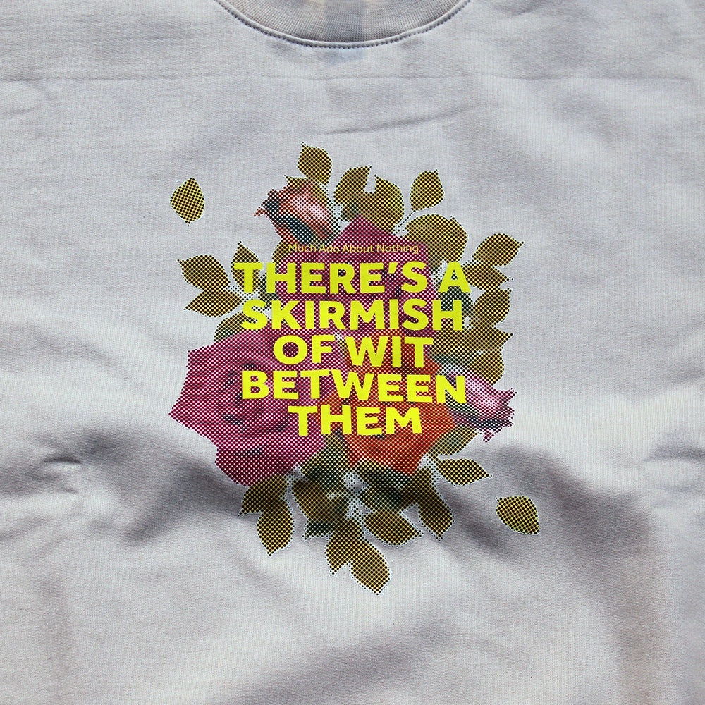 
                  
                    Sand coloured sweatshirt with pixelated image of roses with yellow graphic text overlayed
                  
                