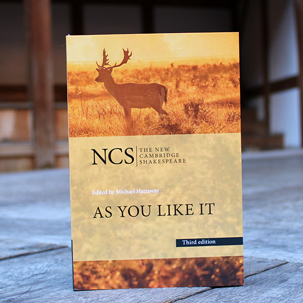 Yellow paperback book with black text and obscured image of a deer in a field