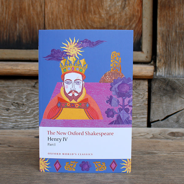 Blue paperback book with purple graphic behind red, orange, gold and brown image of a king