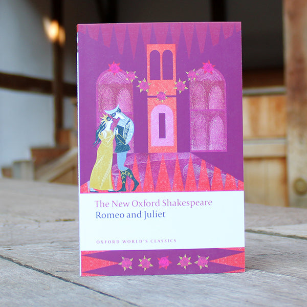 Purple paperback book with cartoon Romeo and Juliet on the cover
