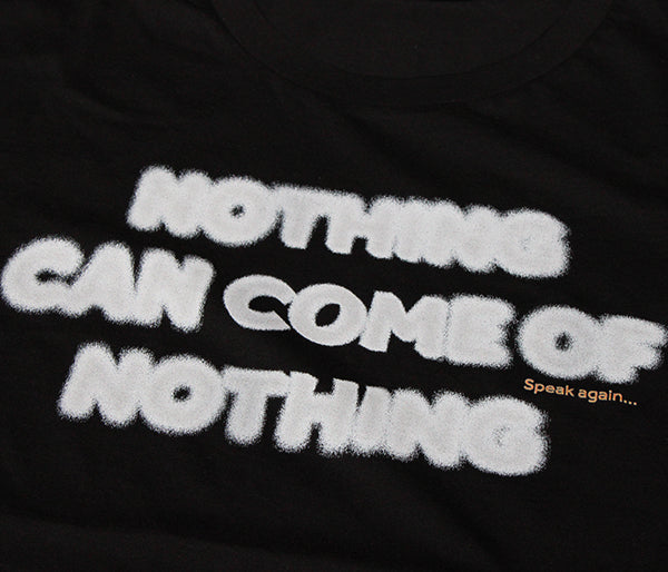 
                  
                    Black cotton t-shirt with white blurred text
                  
                