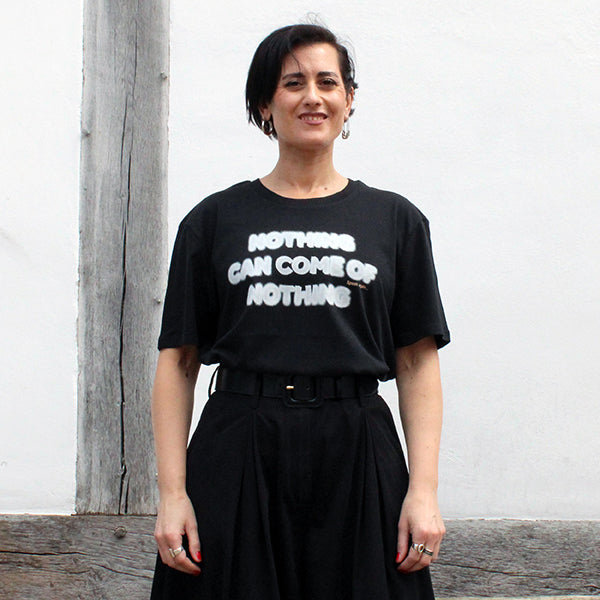 
                      
                        Black cotton t-shirt with white blurred text
                      
                    