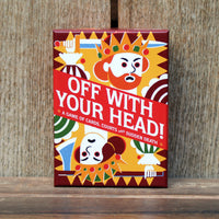 The game box for 'Off With Your Head!' stands upright on a rustic wooden surface against a matching wood plank background. The box features a bold, colorful, folk-art style illustration with a red background, a yellow crown, and white text.