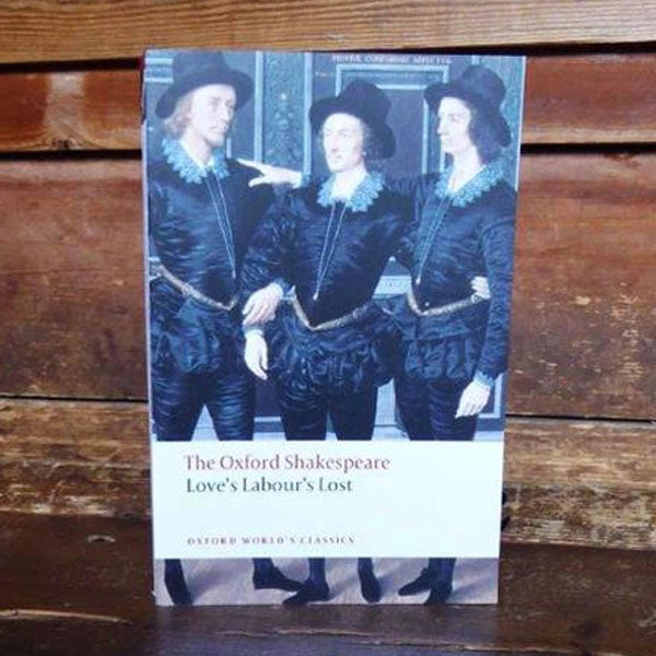 Paperback book featuring 3 men in black hats, doublets, trousers and general Elizabethan garments 