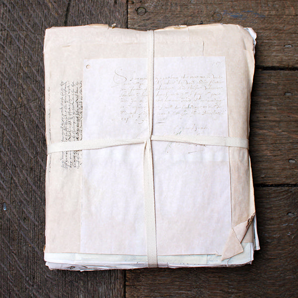 old papers with text on a wooden surface