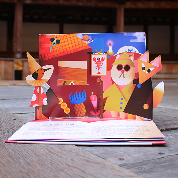 Inside of a pop up book with a brightly coloured scene