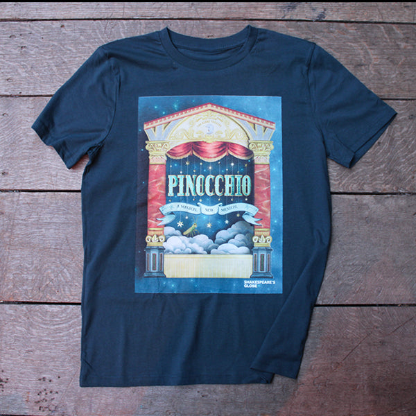 Denim blue t-shirt with 'Pinocchio' theater poster design on a wooden surface