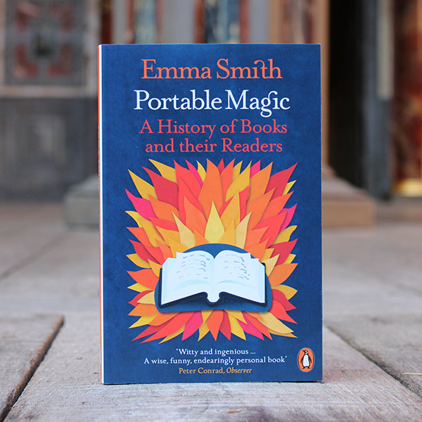 Paperback copy of 'Portable Magic' by Emma Smith sitting on a wooden stage