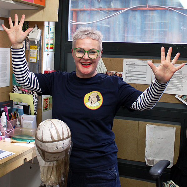 Navy blue cotton t-shirt with a yellow oval containing a cartoon portrait of Shakespeare on the top left chest