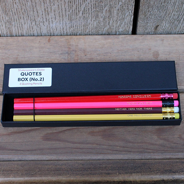 Black card box with white sticker, with 4 pencils, maroon, yellow, red and pink, stamped with text