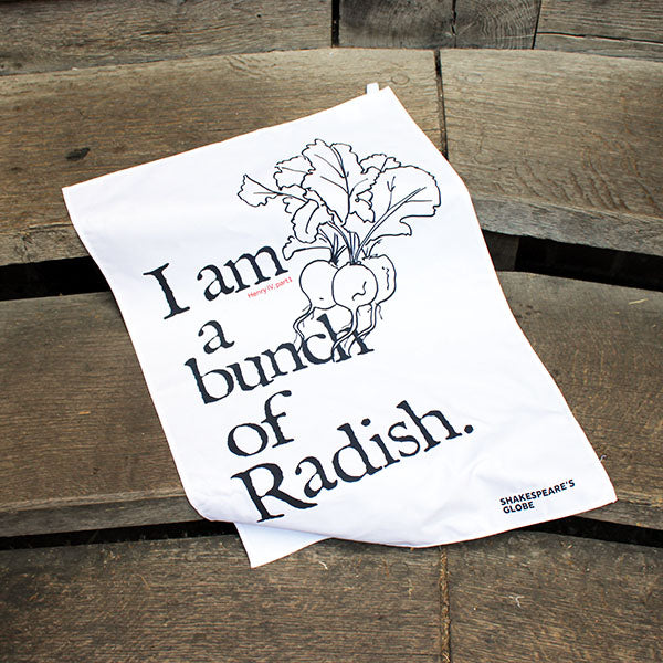 white tea towel with black text and an illustration of a bunch of radish print