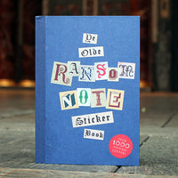 Blue sticker book with vintage letter design on a wooden surface