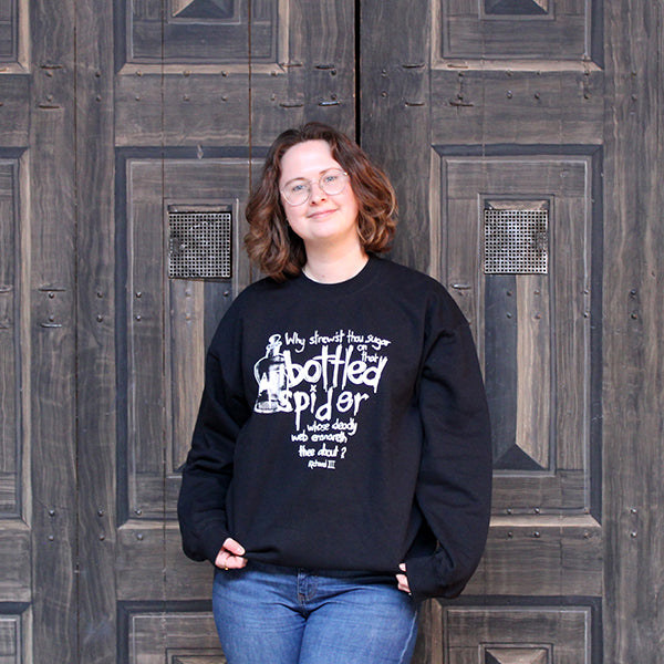 Black unisex sweatshirt with white graphic text in centre, scratchy stylised text and spider in bottle graphic image