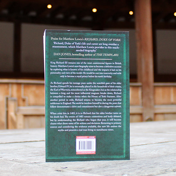 
                  
                    Forest green paperback book with white text
                  
                