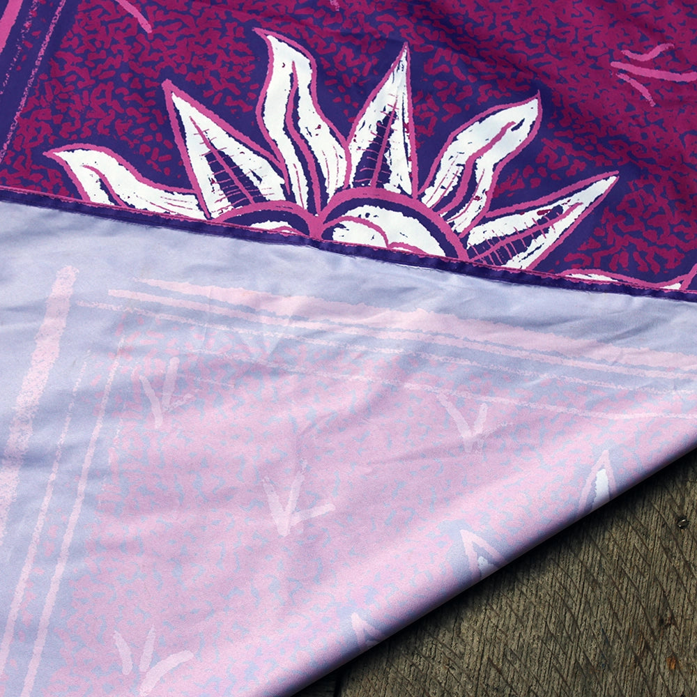 Screen printed fabric banner, with purple, pink and white graphics, sewn edges and white back