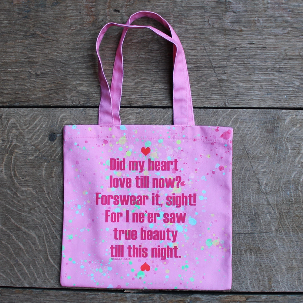 
                      
                        Bubble gum pink tote bag with bright pink writing and yellow, teal and green paint splatter and red hearts
                      
                    