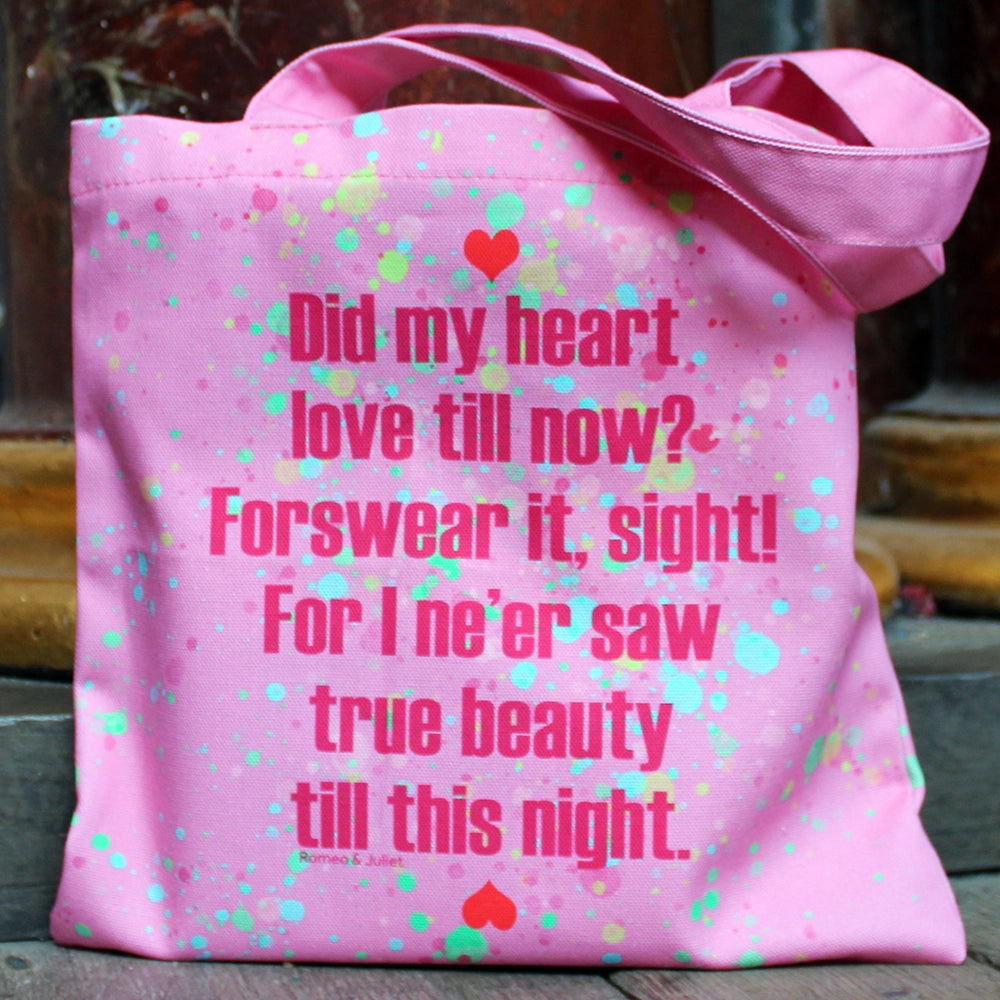 
                      
                        Bubble gum pink tote bag with bright pink writing and yellow, teal and green paint splatter and red hearts
                      
                    