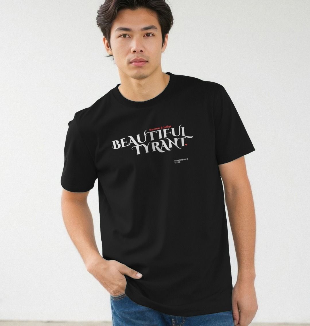 Person wearing a black t-shirt with 'Beautiful Tyrant' text on a white background