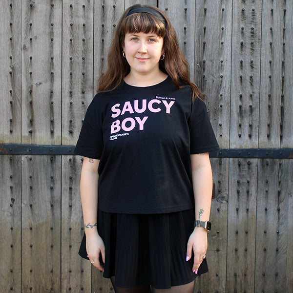 Black cotton boxy fit t-shirt with orange to pink gradient text graphic across centre front