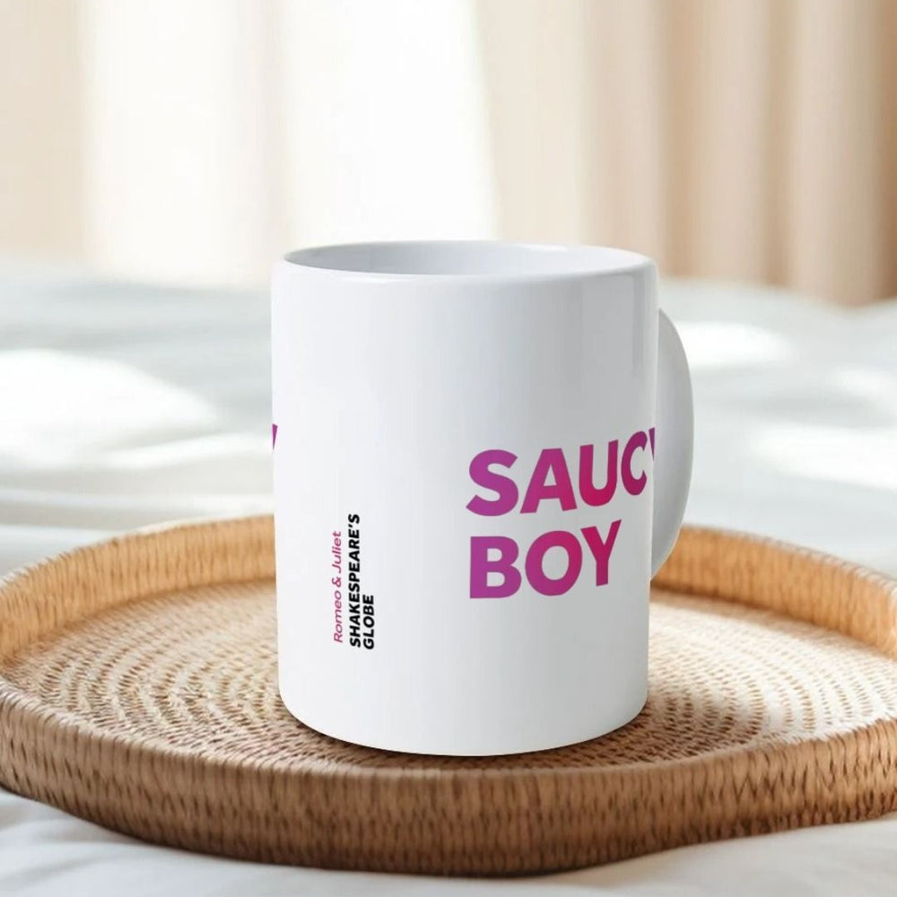 
                  
                    White mug with gradient dark to light pink text graphic in centre front, graphic repeated on both sides of the mug
                  
                