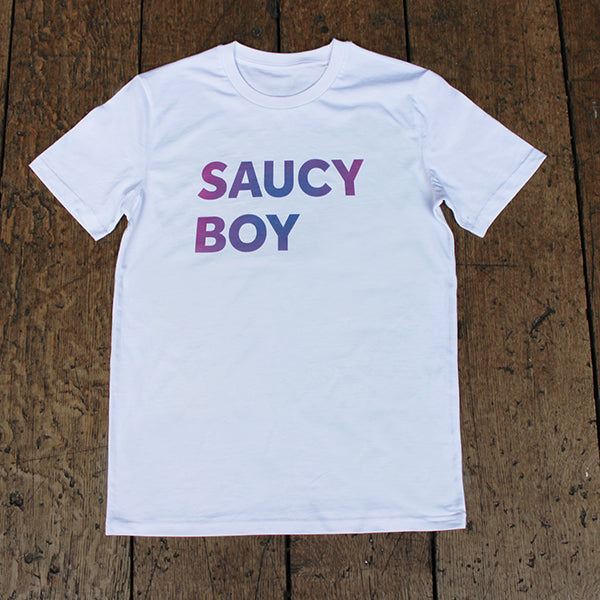 
                      
                        White t-shirt with gradient text purple and blue, two lines of capitalised text reading: SAUCY BOY
                      
                    