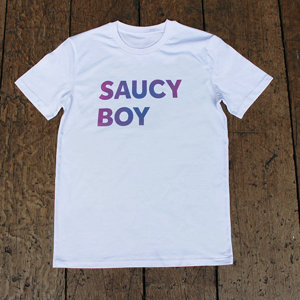 White t-shirt with gradient text purple and blue, two lines of capitalised text reading: SAUCY BOY