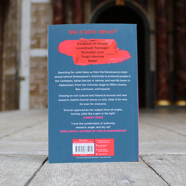 
                  
                    Navy blue paperback book with red paint swatch and black, pink, and white text
                  
                