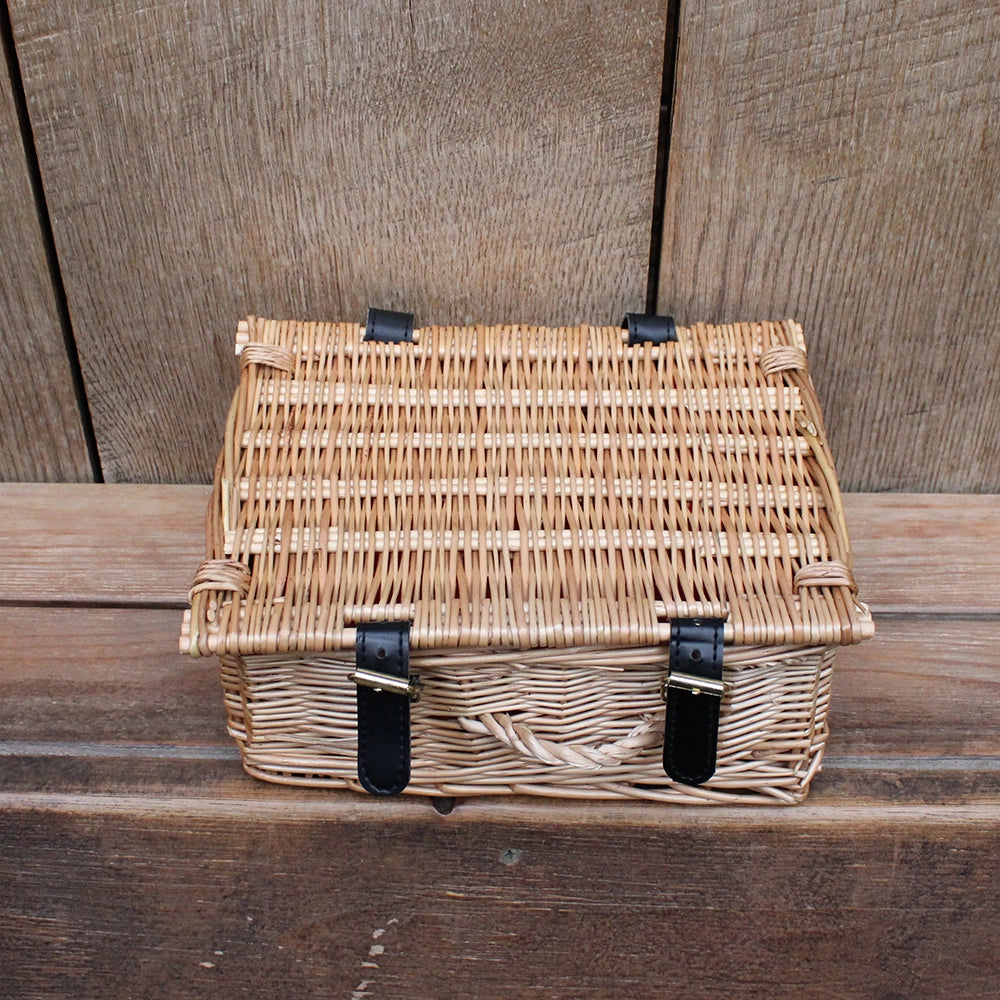 
                  
                    Wicker hamper closed on wooden shelf
                  
                