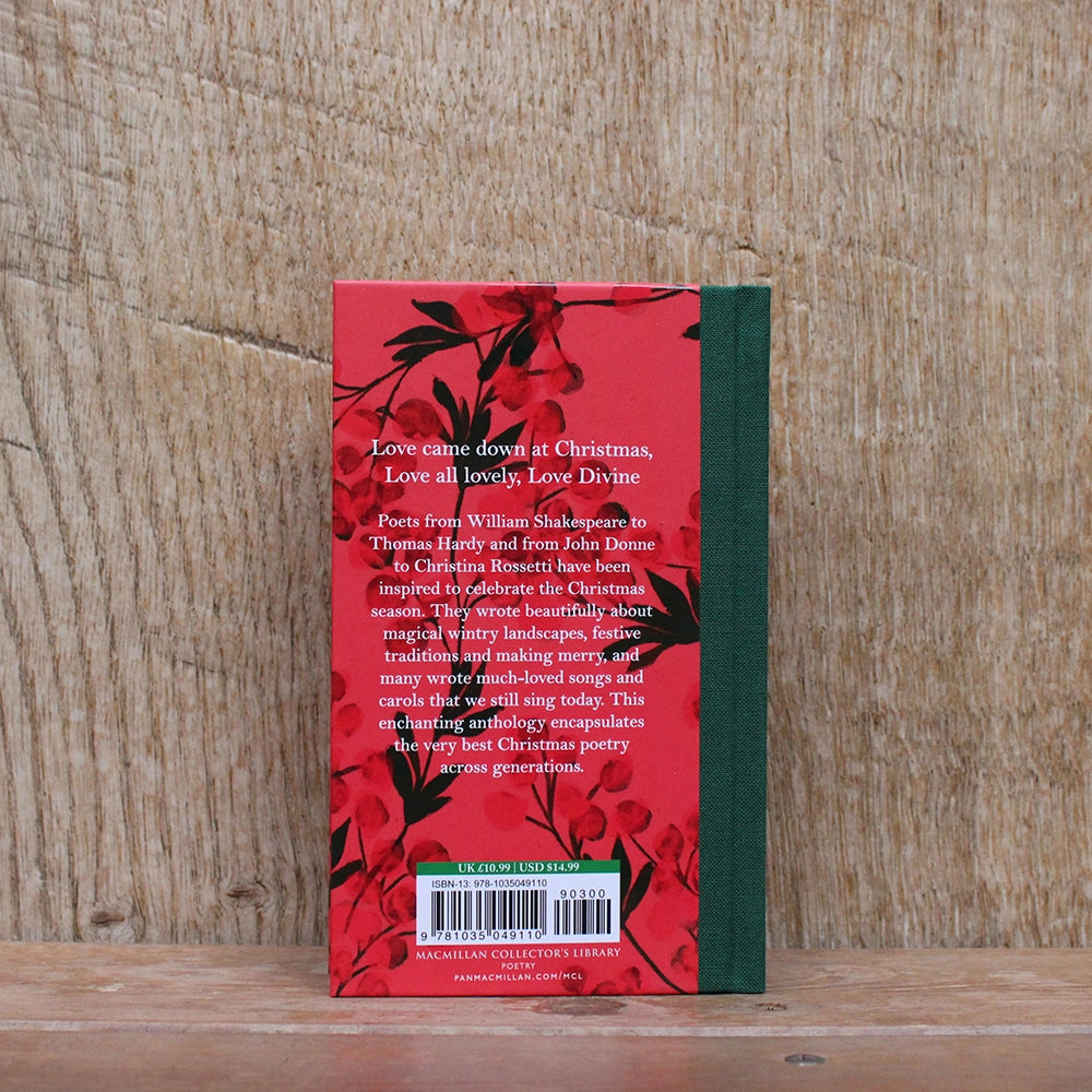 
                  
                    Red hardback book with green spine and white text, featuring red Christmas greenery images
                  
                