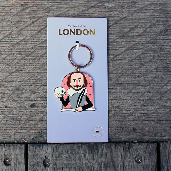 
                      
                        Metal cartoon Shakespeare keyring on pale purple card backer
                      
                    