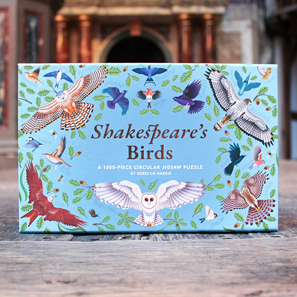 Shakespeare's Birds puzzle box with bird illustrations on a wooden surface