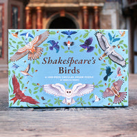 Shakespeare's Birds puzzle box with bird illustrations on a wooden surface