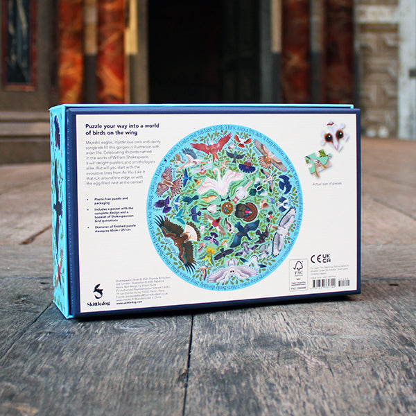 Puzzle box with colorful illustrations of birds on a wooden surface