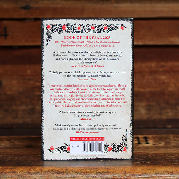 White paperback book with red and black decorative motif and god text