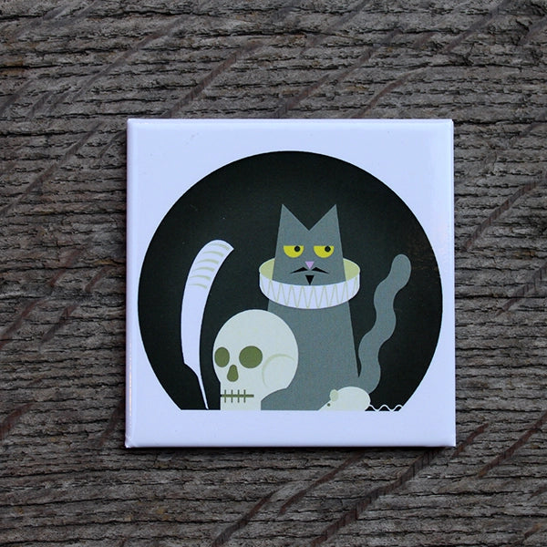 White square magnet with black circular graphic with grey cat in ruff sitting in it