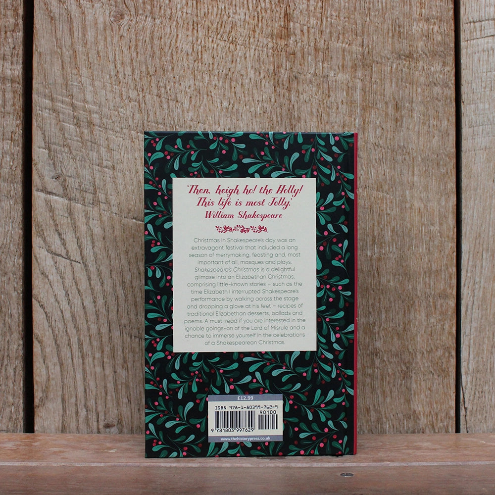 
                  
                    Hardback book with printed festive greenery and berries graphic all over, with white text box and green and red text
                  
                