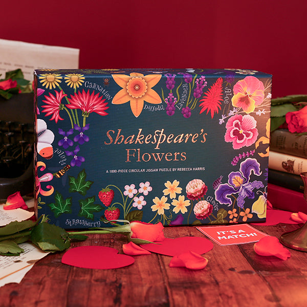 Green box with colourful images of flowers on it, the words 'Shakespeare's Flowers' are printed in the middle in gold.
