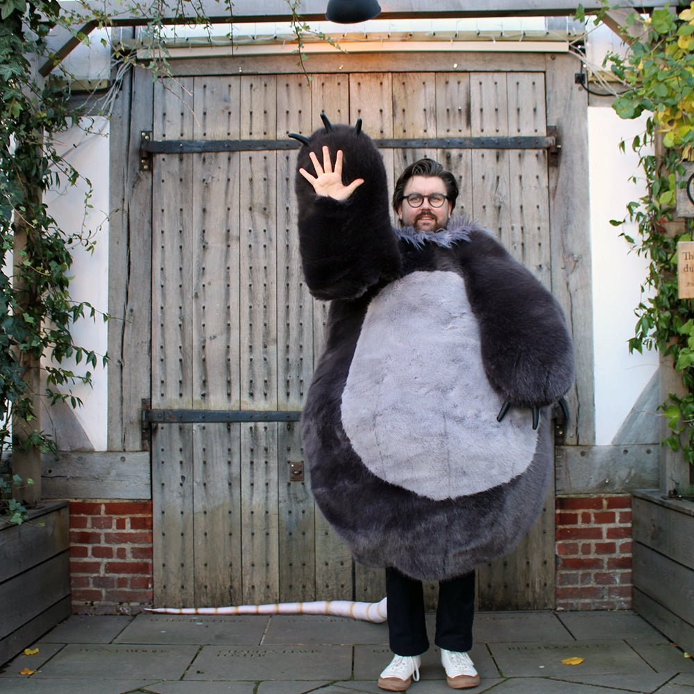 
                  
                    Oversized shrew, rodent costume in shades of grey with natural beige tail
                  
                