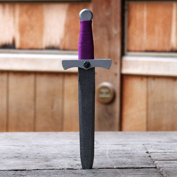 
                  
                    Wooden dagger painted silver with purple wrapped string handle
                  
                