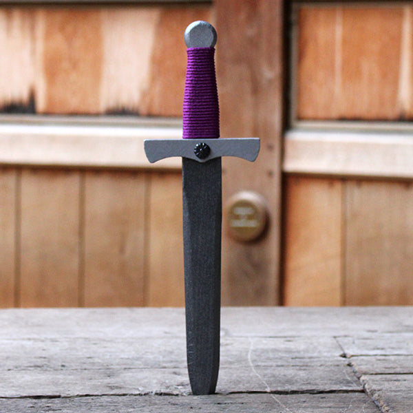 Wooden dagger painted silver with purple wrapped string handle