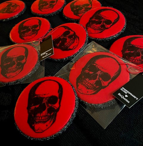 
                      
                        Red circular biscuit with black skull print and black crystal surround
                      
                    