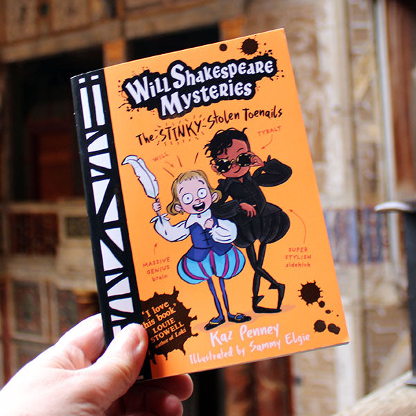 Book titled 'Will Shakespeare Mysteries: The Stinky Stolen Toenails' held by a hand with a blurred background.