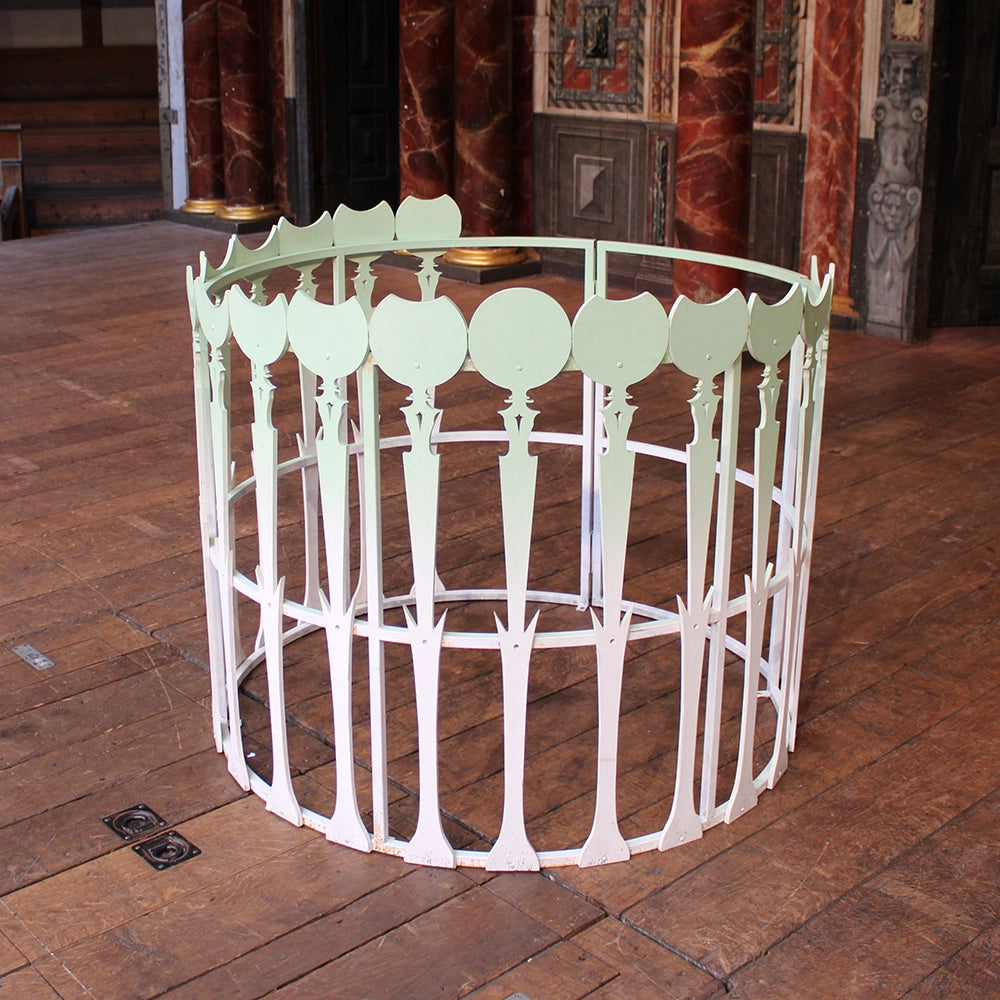 Metal circular cage with gradient seafoam green colouring