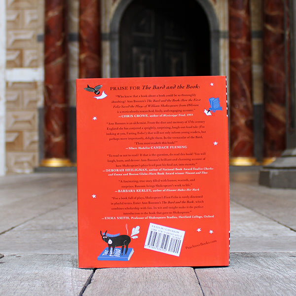 
                  
                    Blue and red hardback book with cartoon Shakespeare and animals and white and pale blue text
                  
                