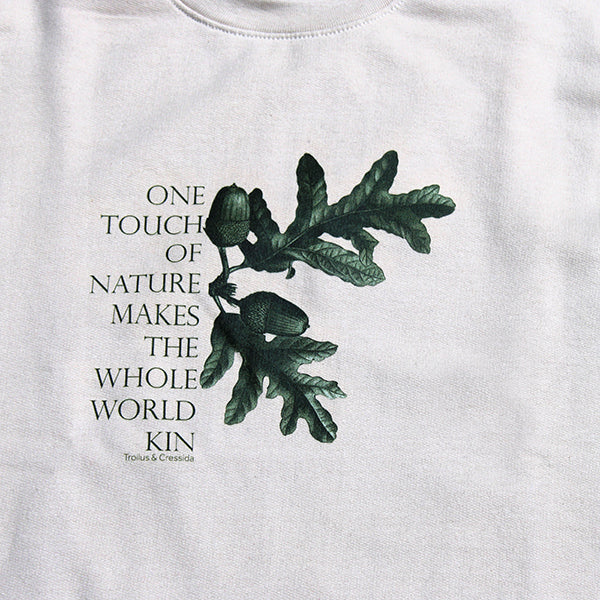 
                      
                        Beige polycotton sweatshirt with central forest green quote and acorn leaf graphic
                      
                    