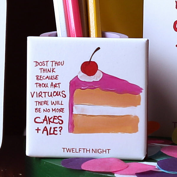 
                  
                    White square magnet with red graphic writing and painted image of beige cake with pink icing and big red cherry on top
                  
                